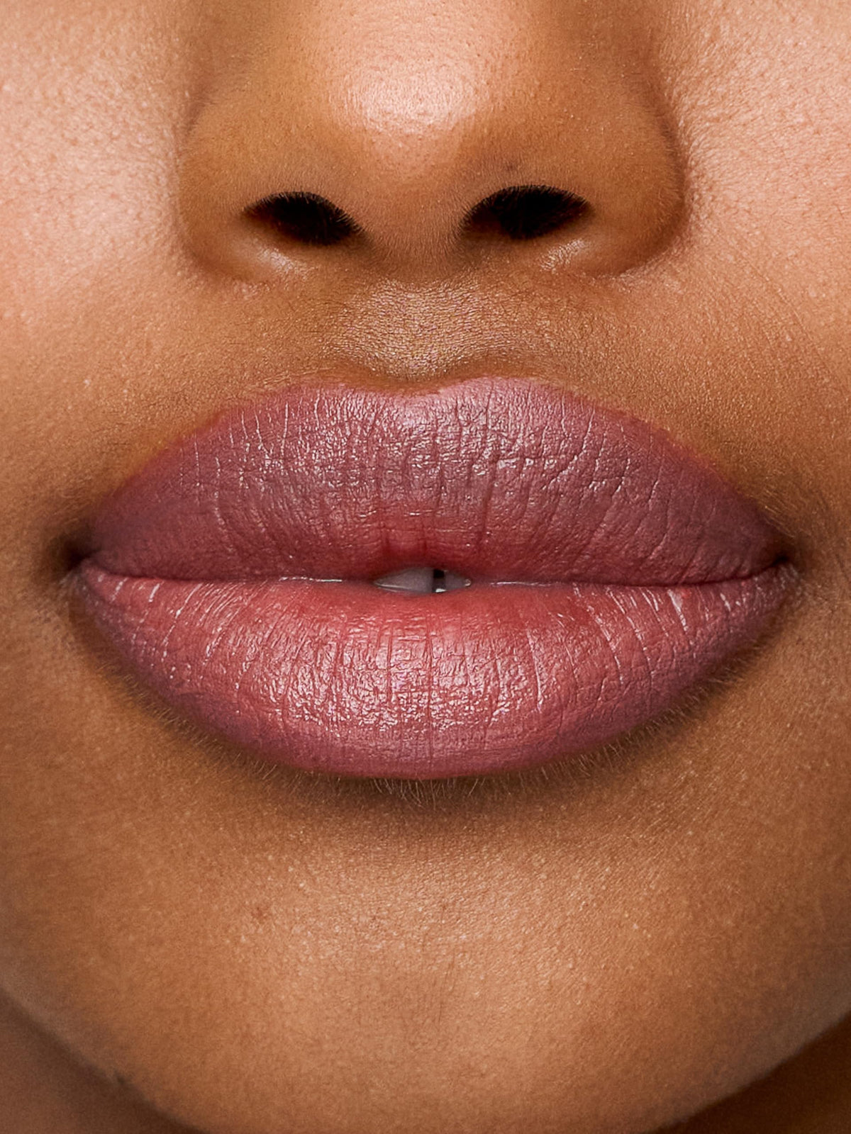 Sweed swatch of Gabriella Beige Rose on arm showing buildable nude-pink color and hydration