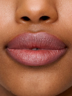 Sweed swatch of Gabriella Beige Rose on arm showing buildable nude-pink color and hydration