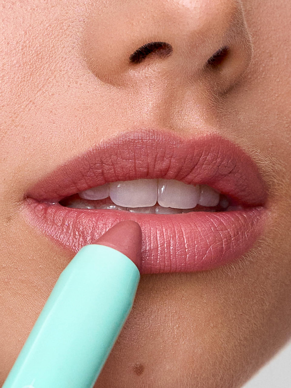 Sweed close-up texture of lipstick tip highlighting creamy, buttery formula for smooth application