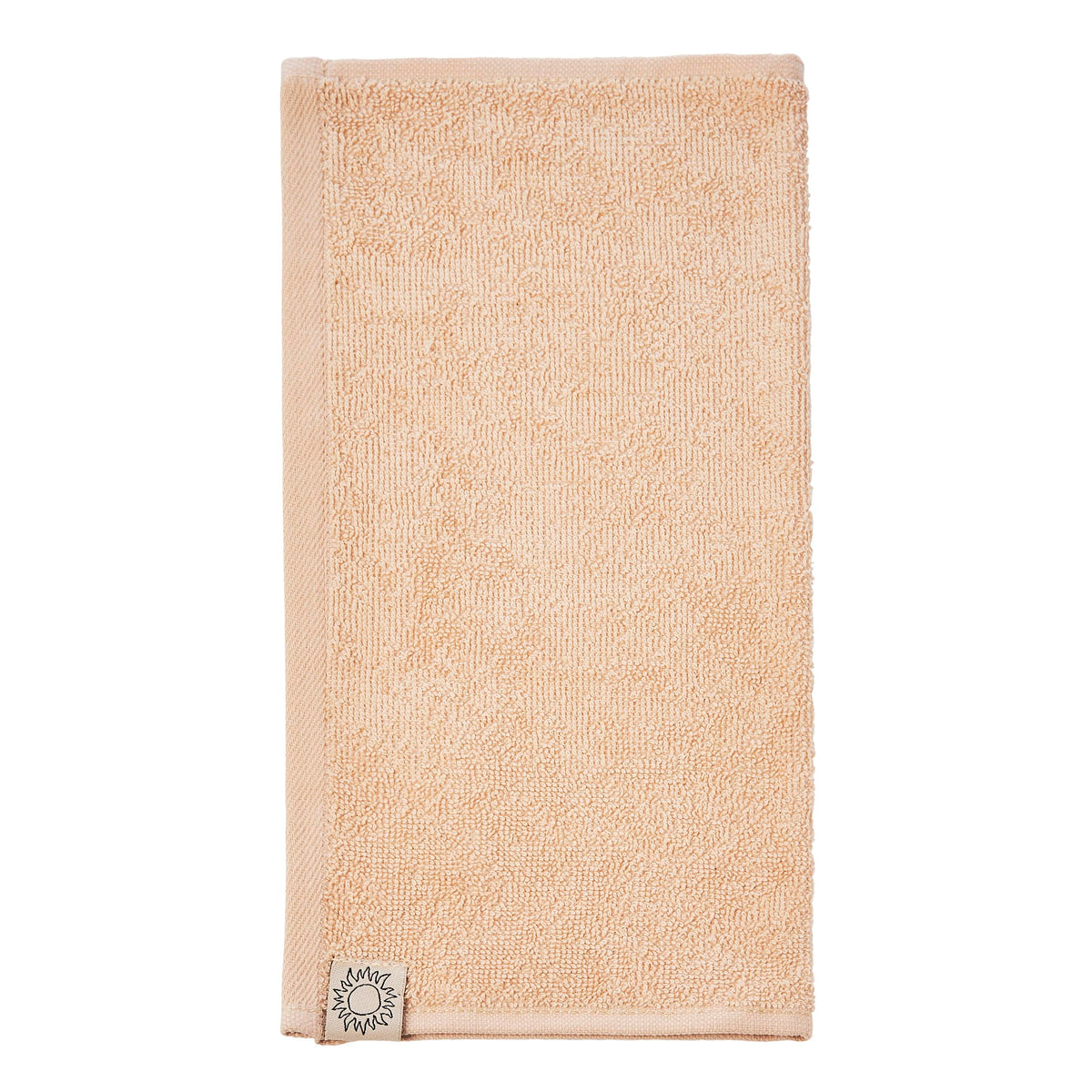 SWEET JULY towels styled on bathroom vanity for an organized skincare display