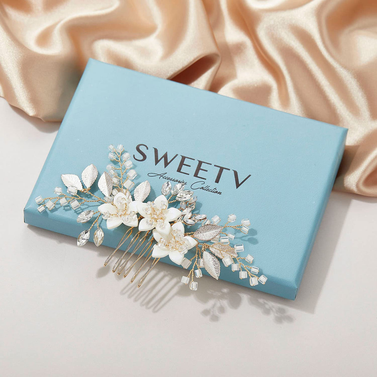 SWEETV bridal lifestyle shot with comb complementing a wedding gown