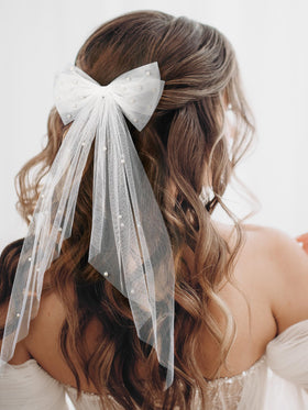 SWEETV satin bow close-up showing smooth fabric and elegant sheen