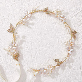 SWEETV headband worn in a bridal updo demonstrating how it complements hairstyles