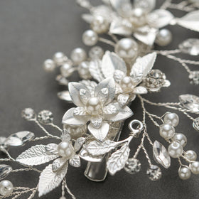 SWEETV worn in a bride half-up hairstyle adding floral accent and soft glamour benefit