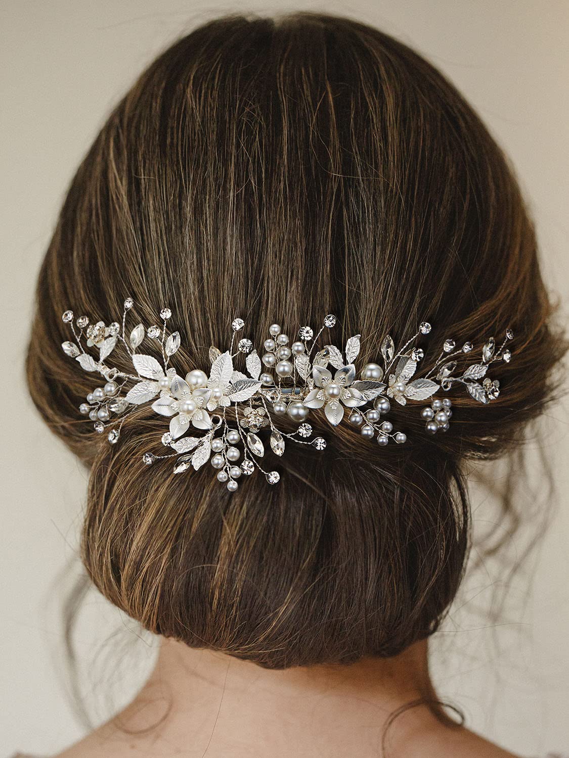 SWEETV placed in a low chignon illustrating classic bridal placement and stability benefit