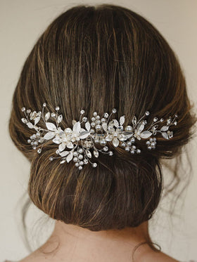 SWEETV placed in a low chignon illustrating classic bridal placement and stability benefit