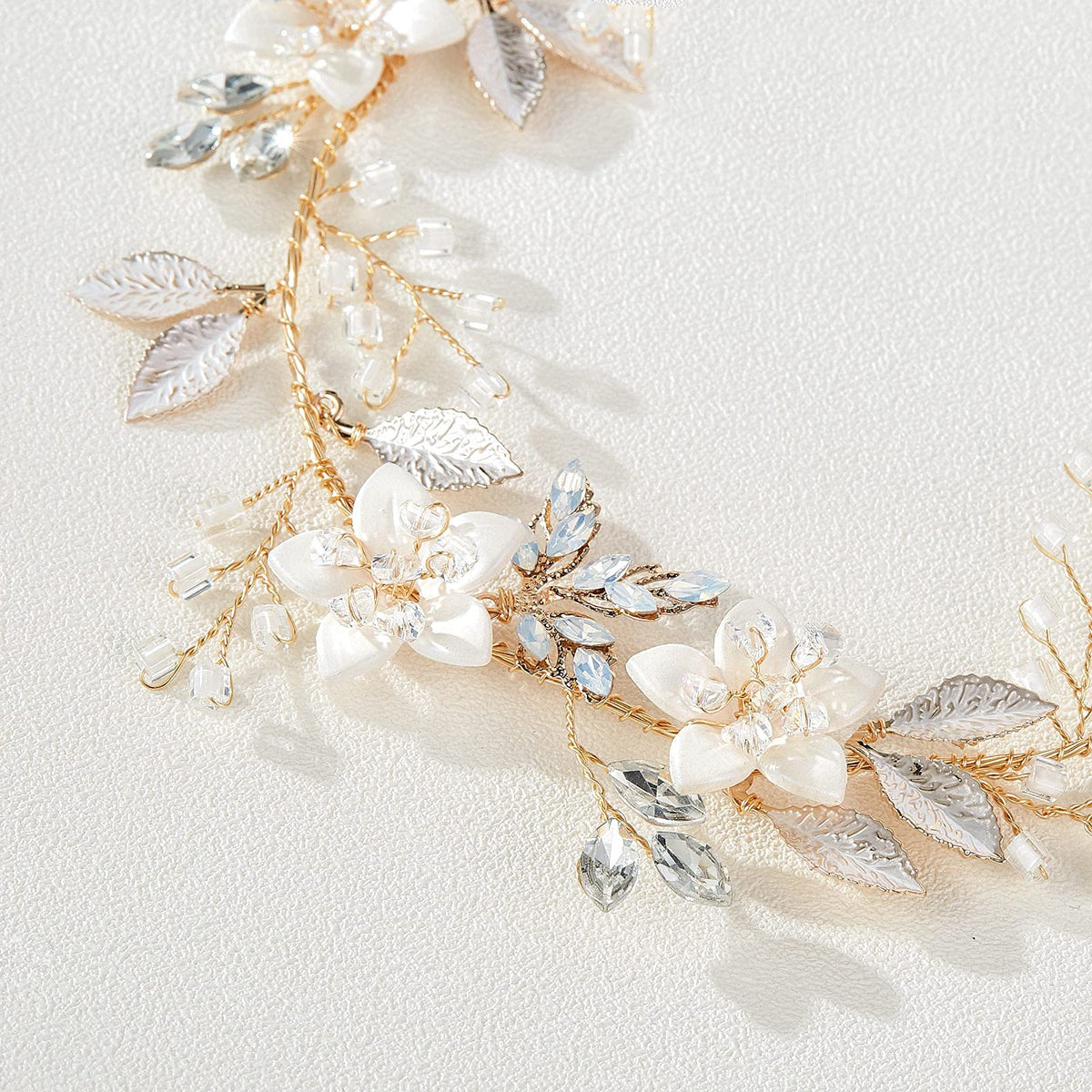 SWEETV headpiece held in hand showing compact 32x4 cm size for scale