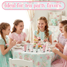 Swiffen mini lotions and balms staged on a tea party table adding coordinated charm to place settings