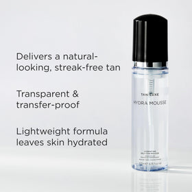 TAN-LUXE application mitt blending mousse evenly for streak-free finish