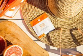 Close-up Tan Towel towelette texture showing clear formula for smooth streak-free application