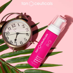 Tanceuticals bottle next to hand for size comparison and travel convenience