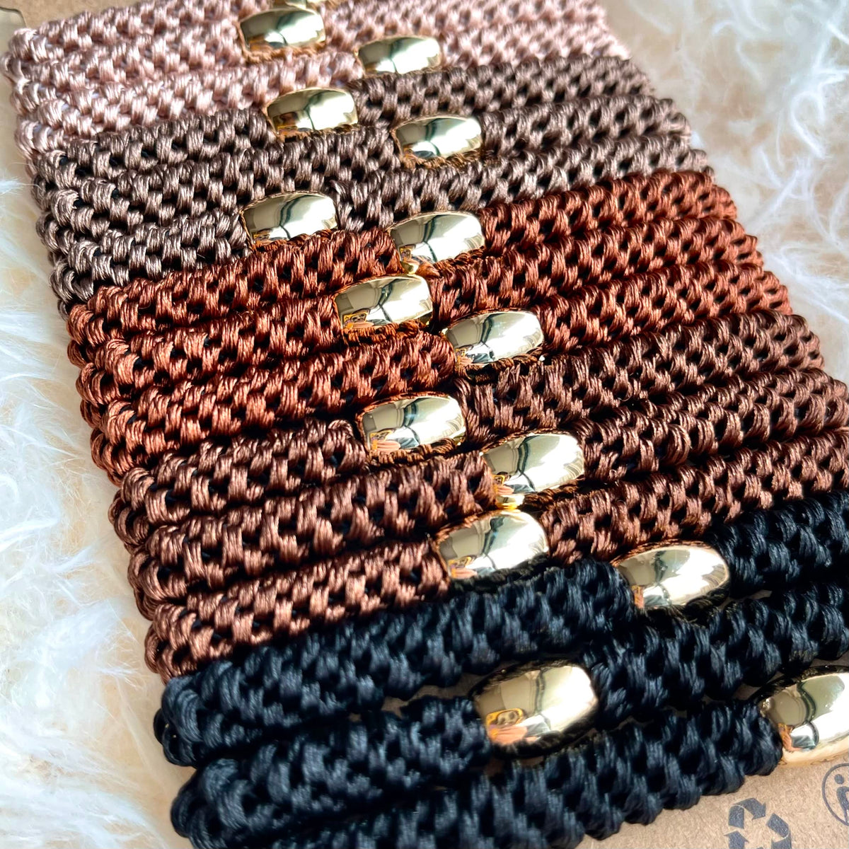Tanha gold-plated bead detail showing decorative accent and secure hold benefit
