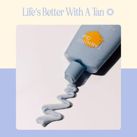 Tanning Club bottle on beach towel lifestyle shot for post-sun comfort