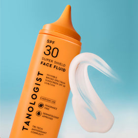 Tanologist applied outdoors on face demonstrating sheer finish and comfortable wear under makeup