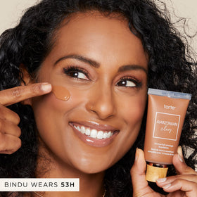 tarte applying foundation from bottle in hand for easy, controlled coverage