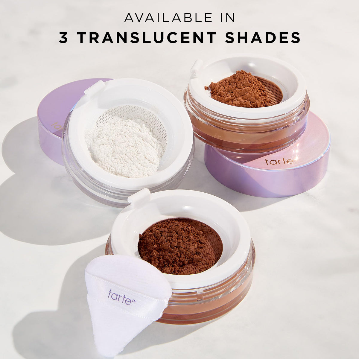 tarte creaseless setting powder next to coin to illustrate full-size scale