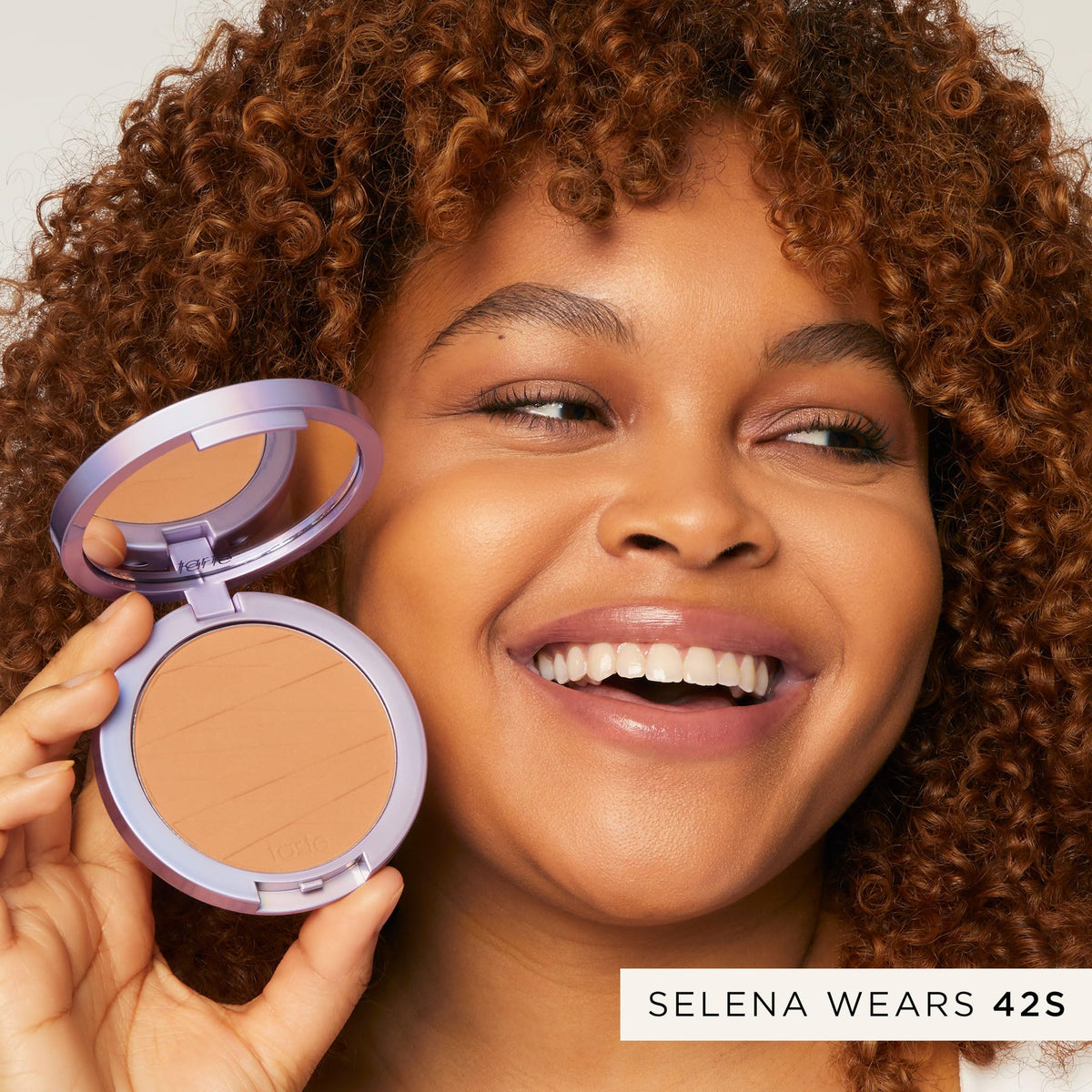 tarte compact inside a purse for travel-ready makeup convenience