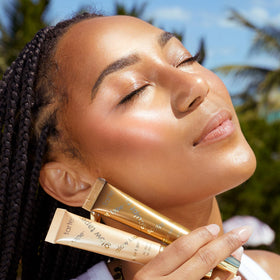 tarte tube in a handbag illustrating travel-friendly, on-the-go radiance