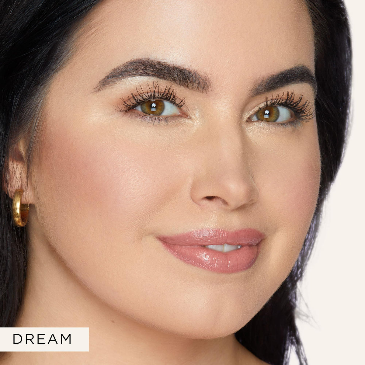 tarte glow wand on model cheekbone illustrating natural radiance benefit