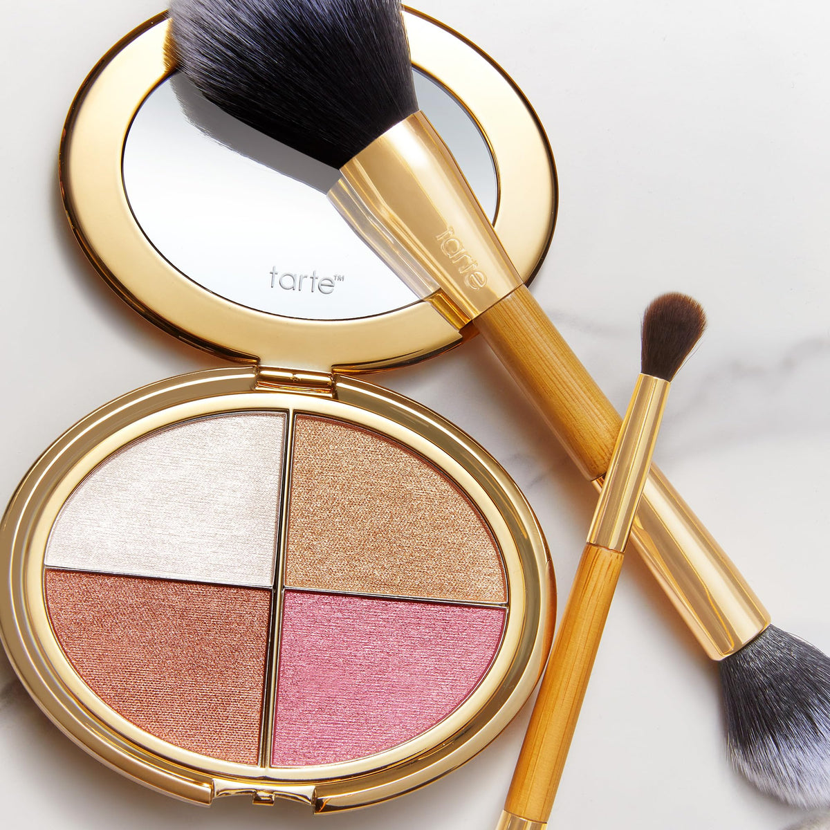 tarte palette beside everyday items to show compact size and portability
