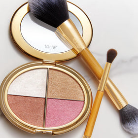 tarte palette beside everyday items to show compact size and portability