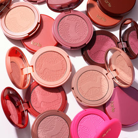 tarte lifestyle model wearing honeysuckle on cheeks demonstrating natural flush and flattering benefit