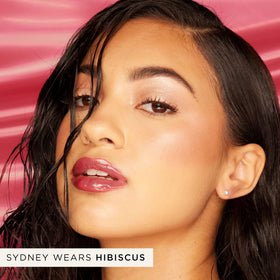 tarte gloss on lips lifestyle shot highlighting juicy mirror-shine effect