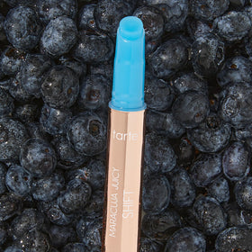 tarte tube next to finger for scale, demonstrating full-size convenience