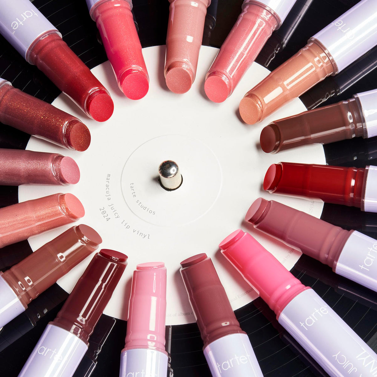 tarte gloss in handbag lifestyle shot for convenient touch-up benefit