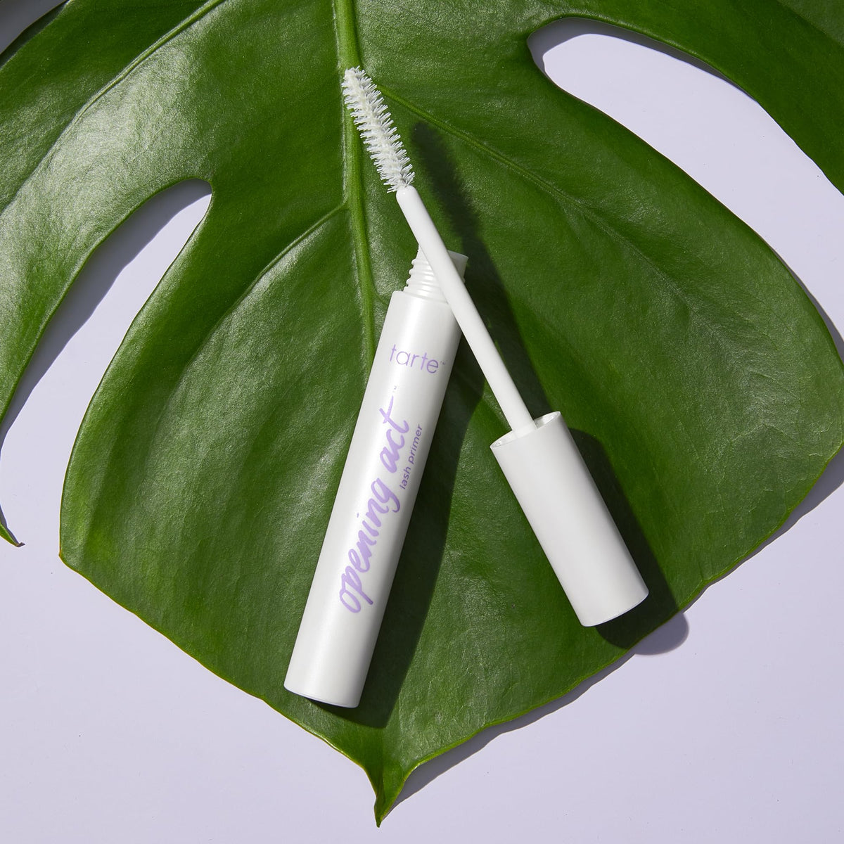 tarte white-tinted primer stroke showing texture and buildable coverage benefits