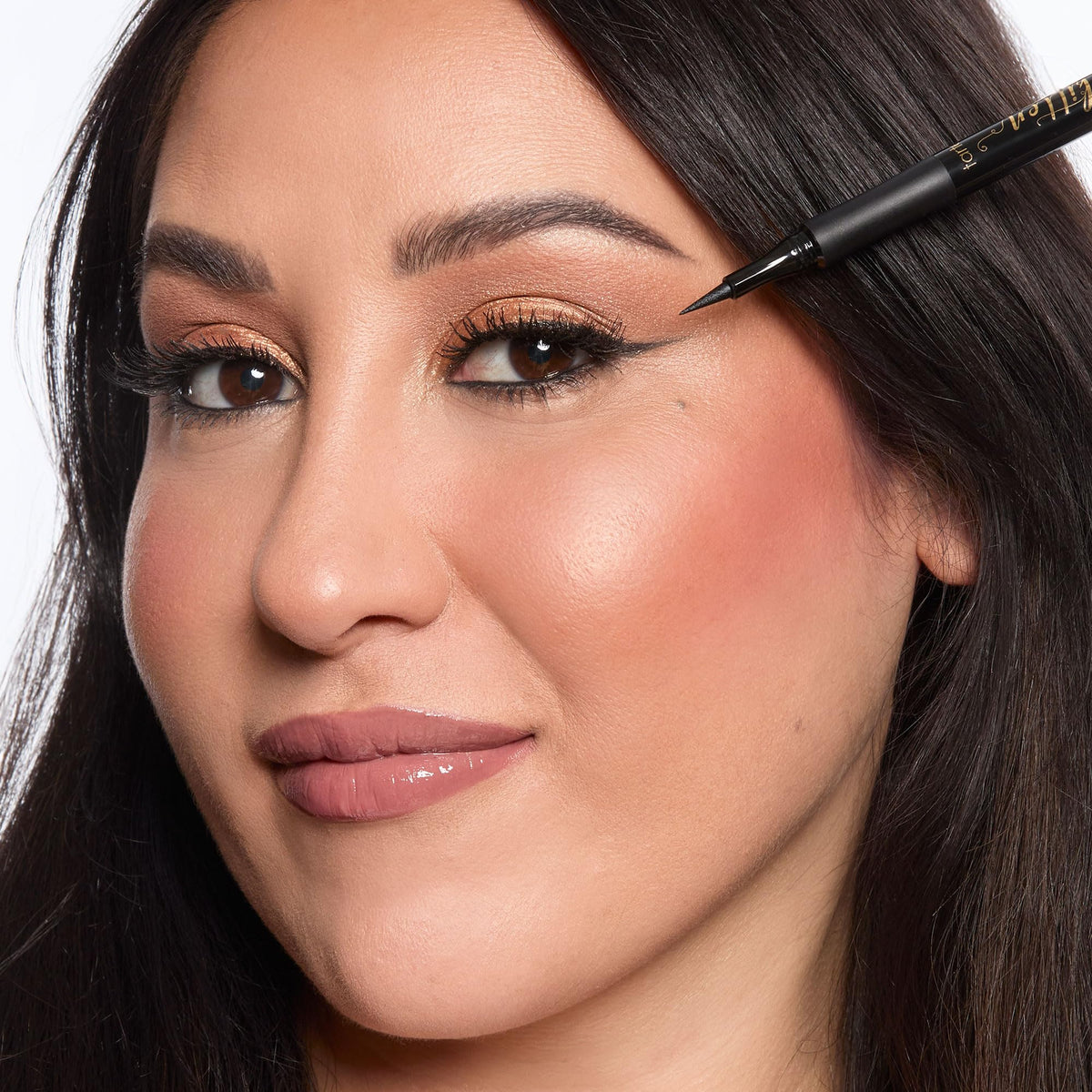 tarte eyeliner pen held in hand to show size and grip benefit: easy handling and control