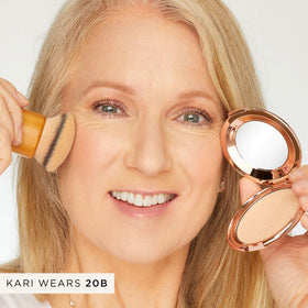 tarte touch-up sponge in hand for quick matte refresh and convenience