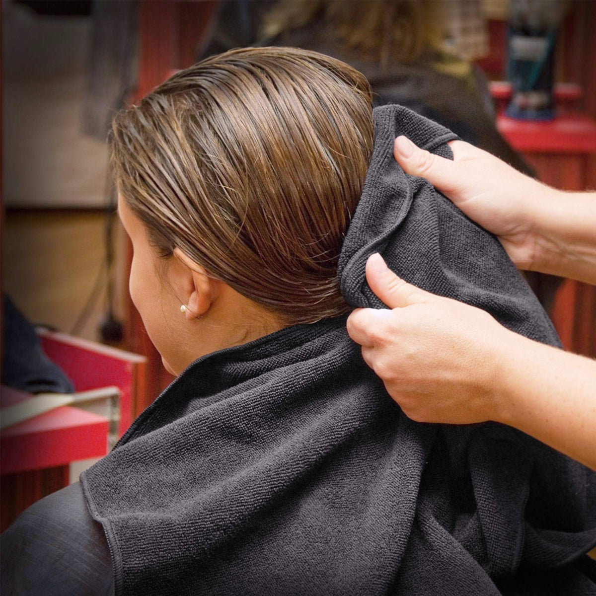 TASALON towels arranged in barber chair setting showing professional, stain-resistant look