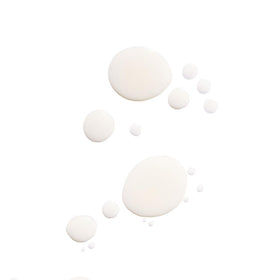 Tata Harper bottle detail with dropper and label highlighting premium formulation