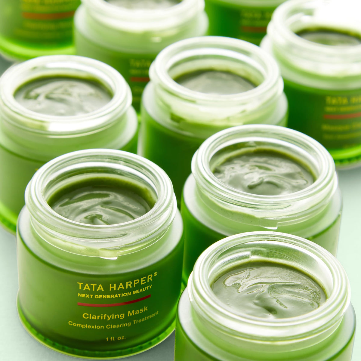 Tata Harper 30ml mask next to coin for scale showing travel-friendly size