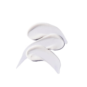 Tata Harper open jar with spatula showing silky gel-cream texture and easy scooping