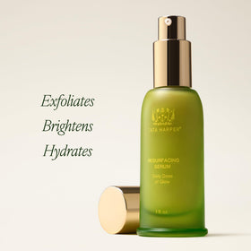 Tata Harper serum drops on hand demonstrating silky texture and absorption