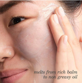 TATCHA balm melting on fingertip demonstrating easy makeup dissolving benefit