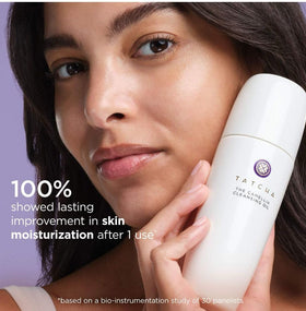 TATCHA rinsing cleansing oil under water showing emulsification and clean rinse