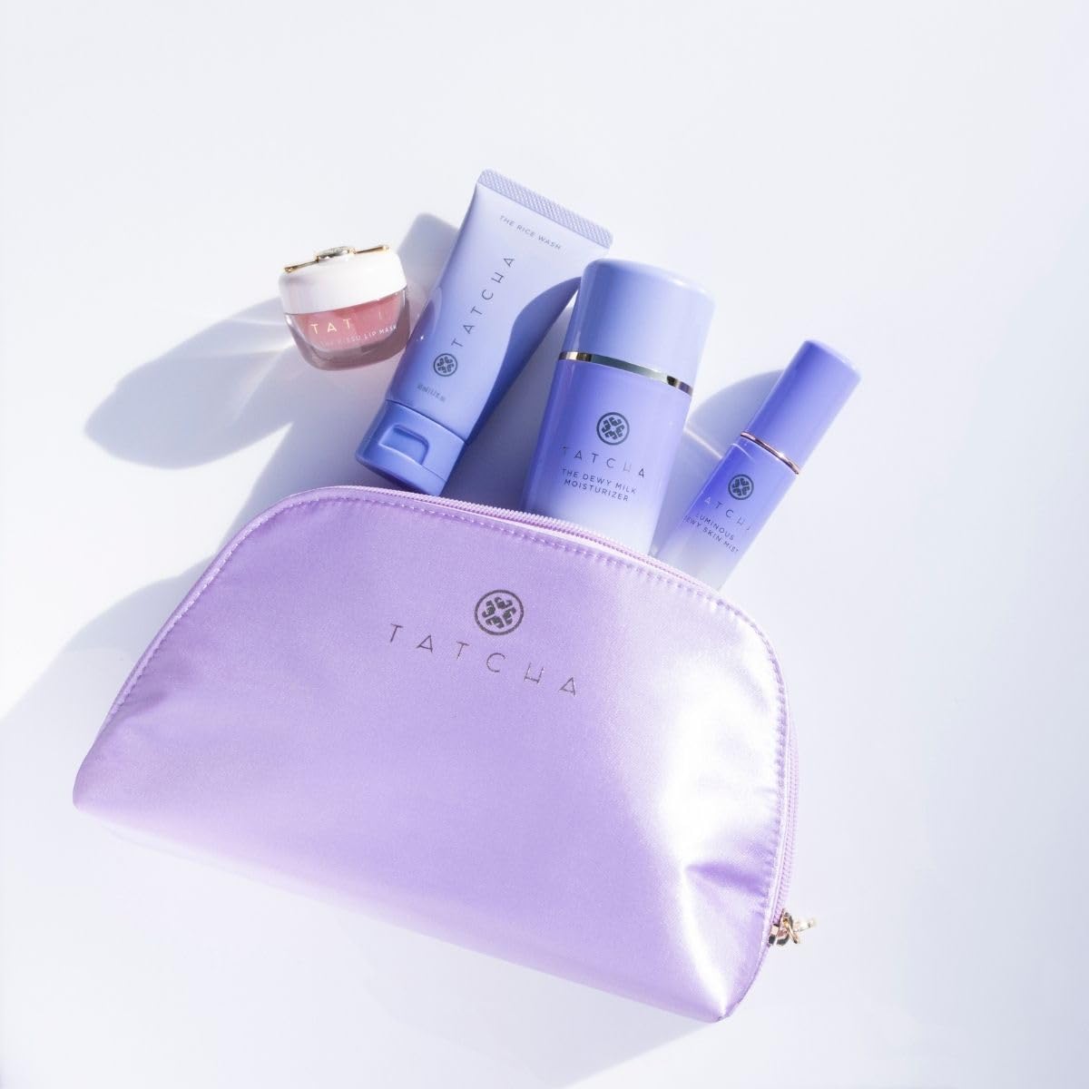 TATCHA kit tucked inside a gym bag for on-the-go skincare convenience