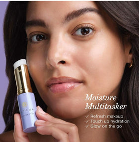 TATCHA serum stick applying under eye to soften fine lines and brighten appearance