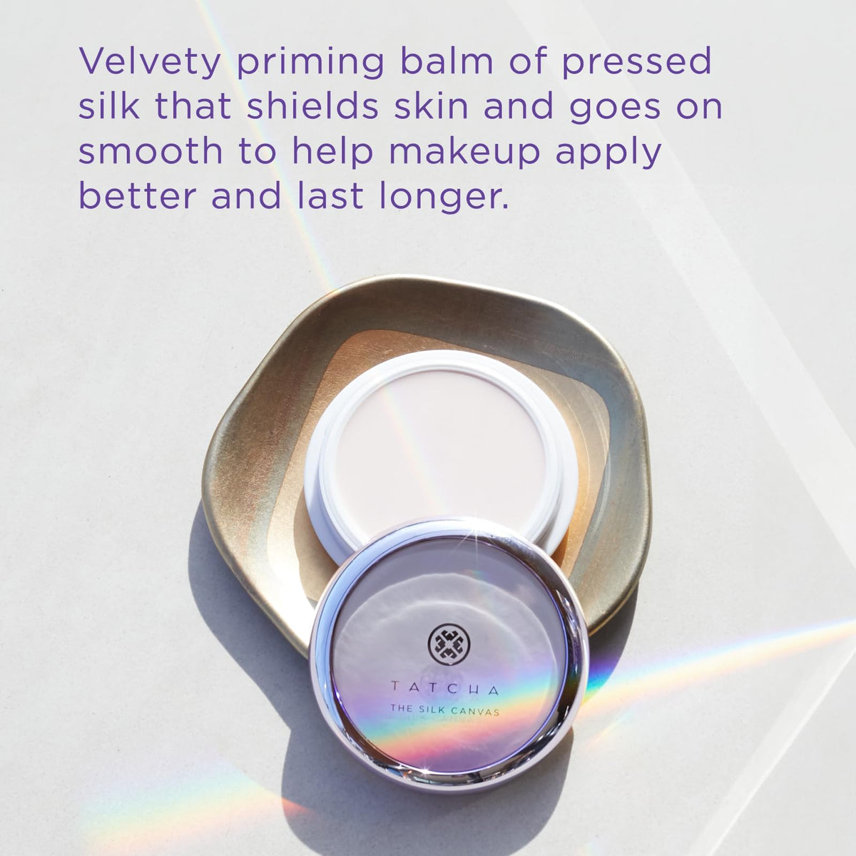 TATCHA Silk Canvas on fingertip demonstrating easy warming and application