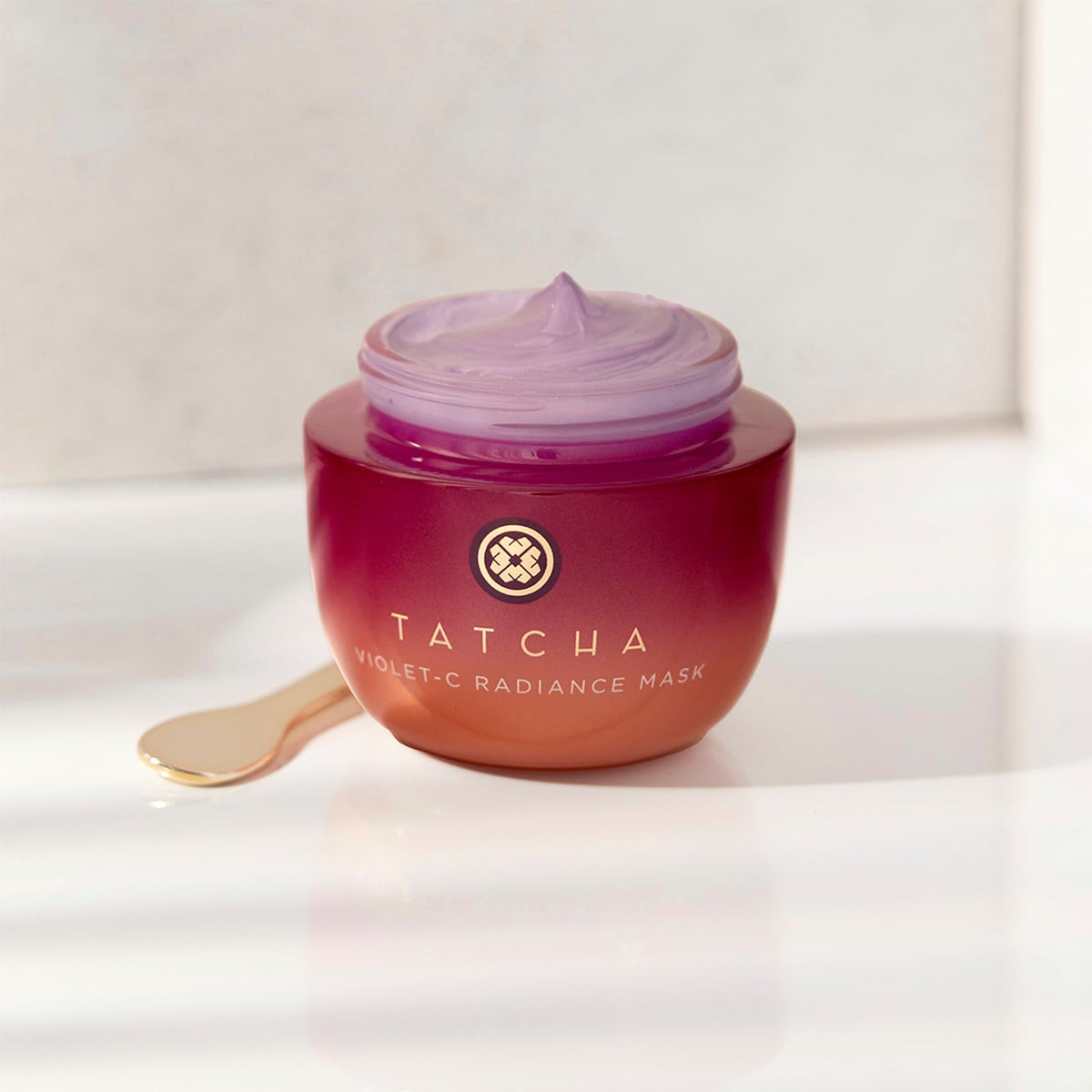 TATCHA 50 ml jar beside common object showing compact travel-friendly size
