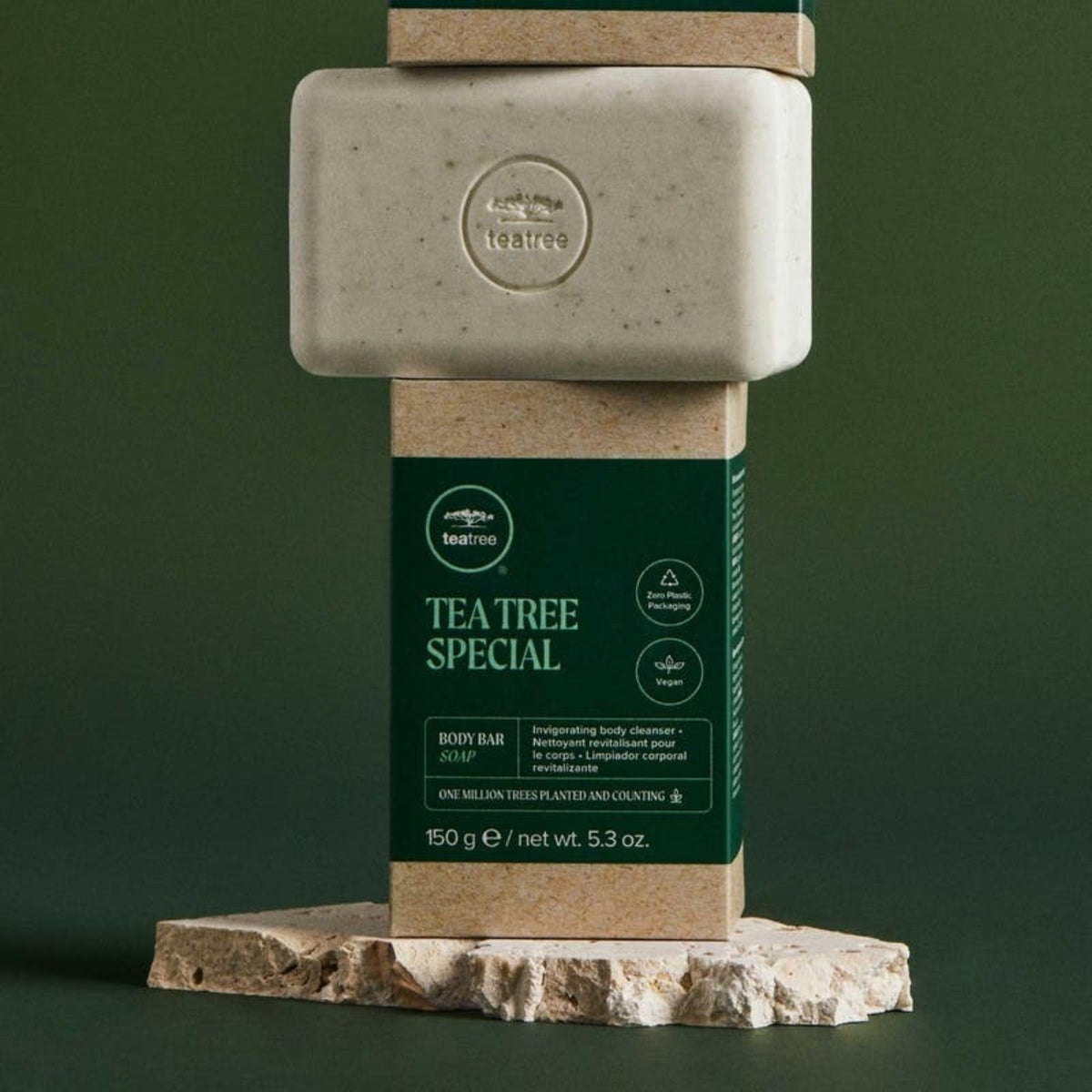 Close-up of Tea Tree bar texture with parsley flakes highlighting gentle exfoliation benefit