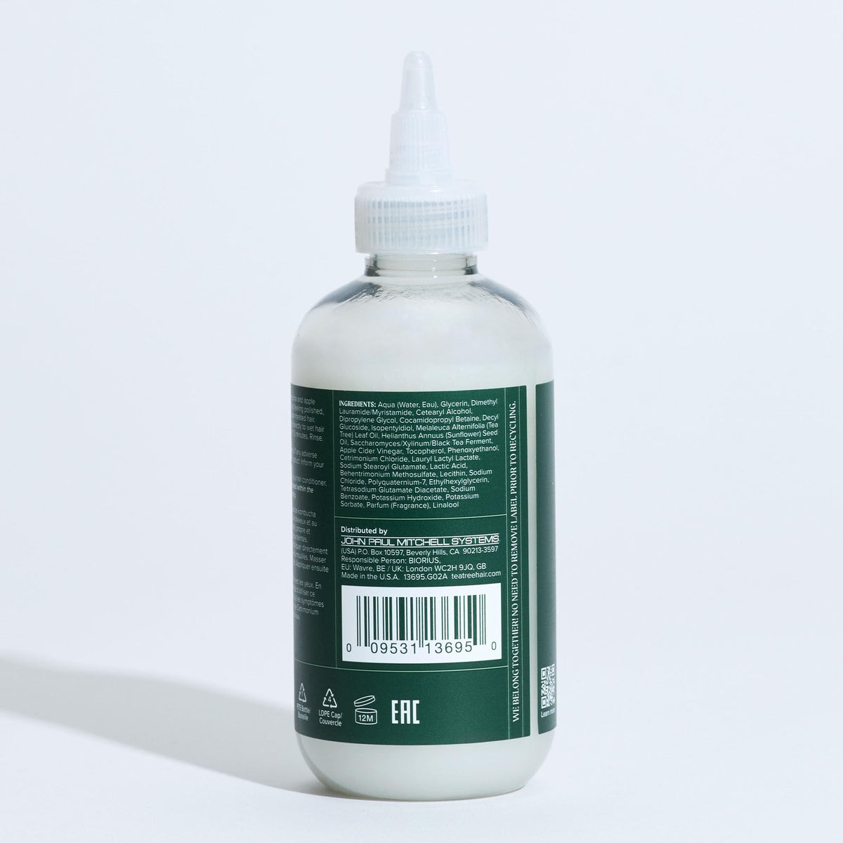 Jar of kombucha next to Tea Tree bottle illustrating probiotic ingredient and clarifying action
