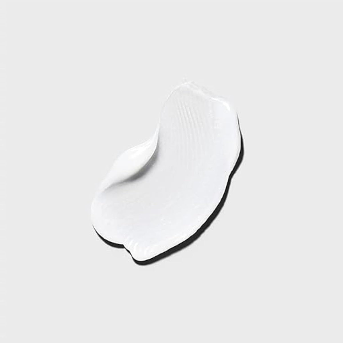 Tea Tree cowash on bathroom shelf in lifestyle scene enhancing spa-like scent
