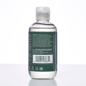 Tea Tree gel on bathroom shelf conveying calming lavender-mint styling routine