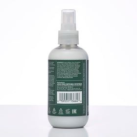 Tea Tree bottle beside everyday items showing 6.8 fl oz scale and travel-friendly benefit