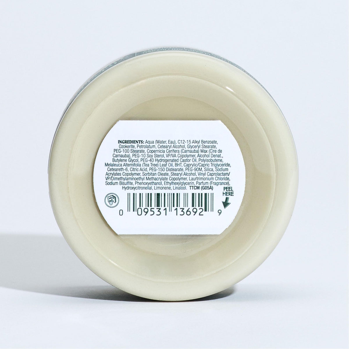 Tea Tree styling cream on bathroom counter in lifestyle scene, shows everyday use