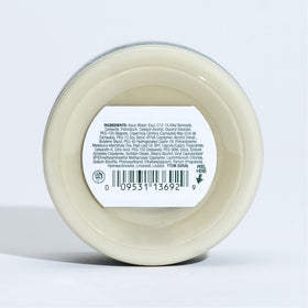 Tea Tree styling cream on bathroom counter in lifestyle scene, shows everyday use